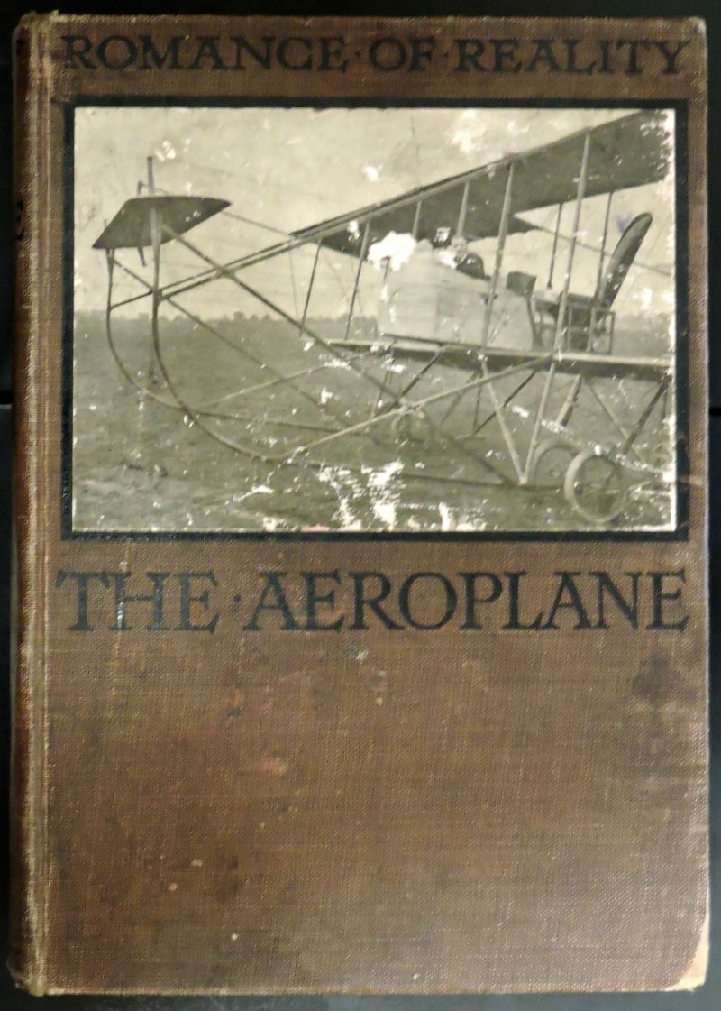 Picture of brown cover of book showing B/W plate of 1914 aeroplane with smartly-dressed pilot at the controls.